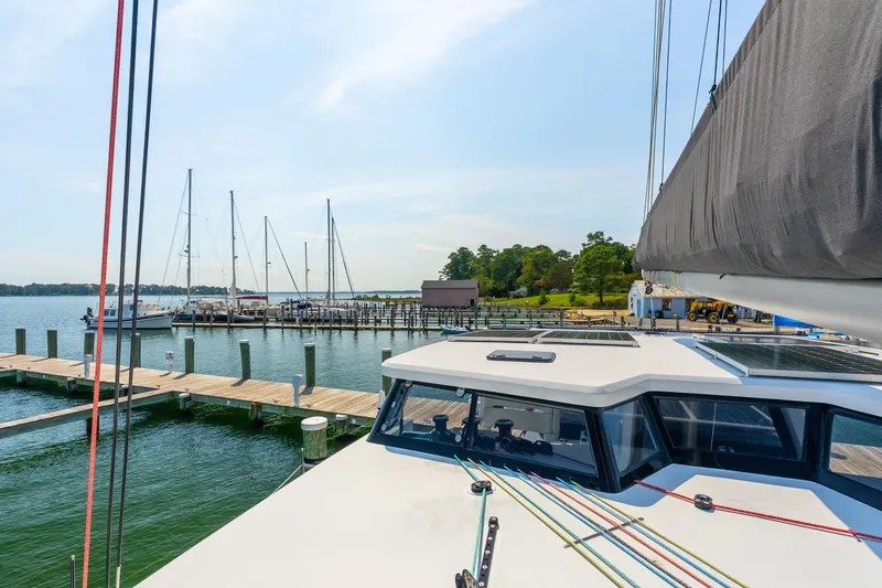 Carolina Red Yacht Photos Pics 2024 St Francis 460 yacht docked at a marina with sailboats and clear skies.