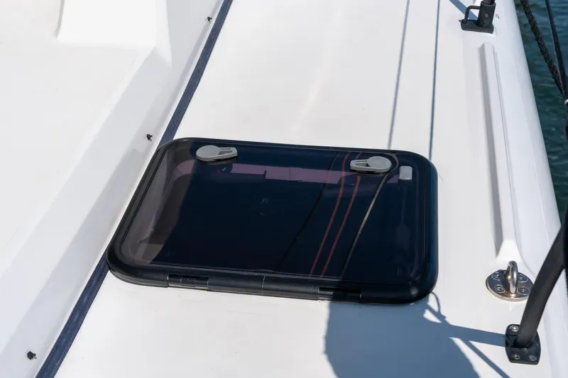 Carolina Red Yacht Photos Pics Hatch on 2024 St Francis 460 yacht deck, featuring sleek design and secure latches.