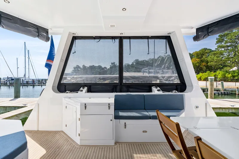 Carolina Red Yacht Photos Pics Modern 2024 St Francis 460 yacht interior with seating and table, docked at marina.