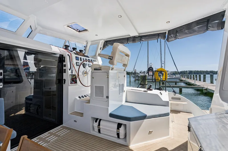 Carolina Red Yacht Photos Pics 2024 St Francis 460 yacht cockpit with modern helm and marina view.