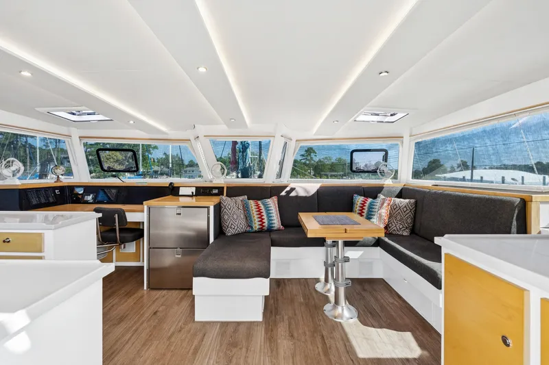 Carolina Red Yacht Photos Pics Luxurious interior of 2024 St Francis 460 yacht with modern seating and panoramic windows.