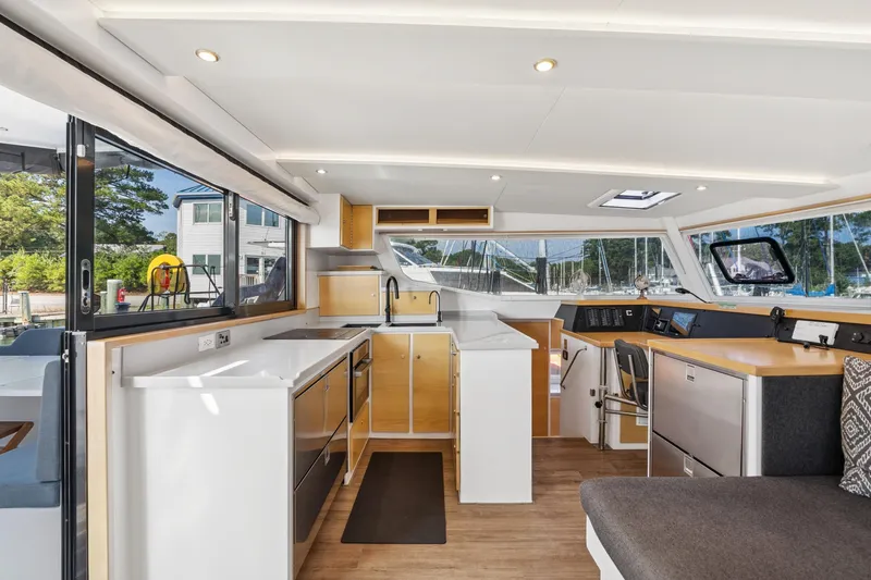 Carolina Red Yacht Photos Pics Modern interior of 2024 St Francis 460 yacht with sleek kitchen and navigation area.