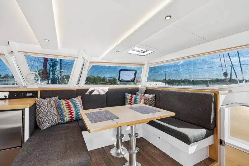 Carolina Red Yacht Photos Pics Modern interior of 2024 St Francis 460 yacht with stylish seating and panoramic windows.