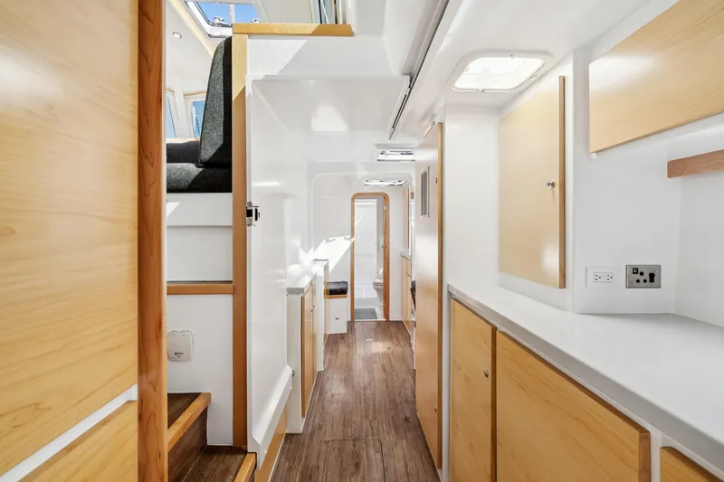 Carolina Red Yacht Photos Pics Modern interior of 2024 St Francis 460 yacht with wood accents and bright lighting.