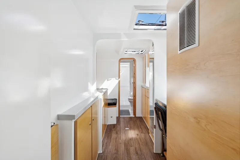 Carolina Red Yacht Photos Pics Modern interior of 2024 St Francis 460, featuring sleek wood finishes and ample natural light.