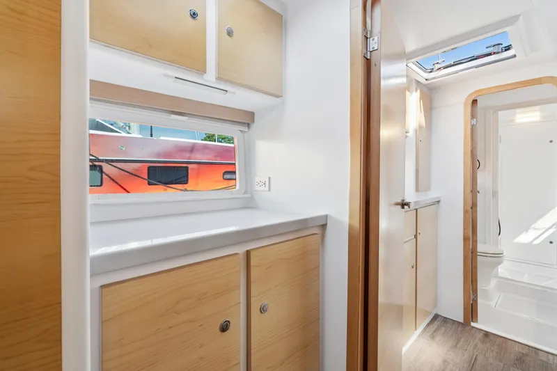 Carolina Red Yacht Photos Pics Modern interior of 2024 St Francis 460 yacht with wood cabinets and bright lighting.