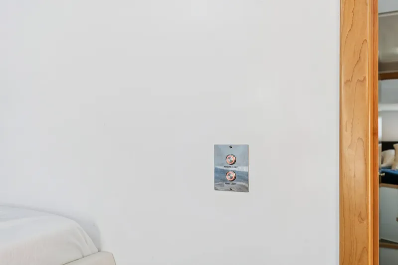 Carolina Red Yacht Photos Pics Interior of 2024 St Francis 460 yacht with light switch and wooden door frame.