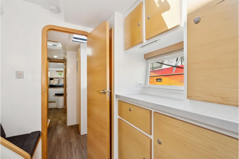 Carolina Red Yacht Photos Pics 2024 St Francis 460 interior with wooden cabinets, modern design, and natural light.