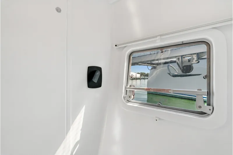 Carolina Red Yacht Photos Pics Interior view of 2024 St Francis 460 boat window with exterior water scene.