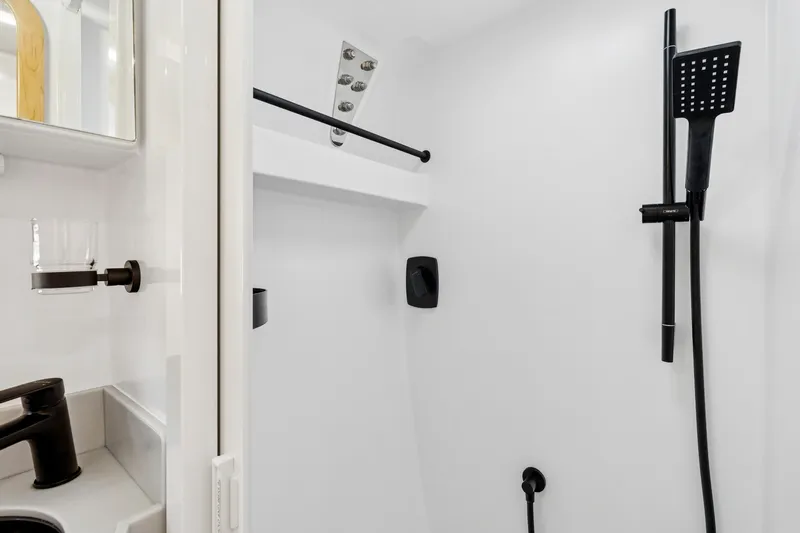 Carolina Red Yacht Photos Pics Modern shower in 2024 St Francis 460, featuring sleek black fixtures and minimalist design.