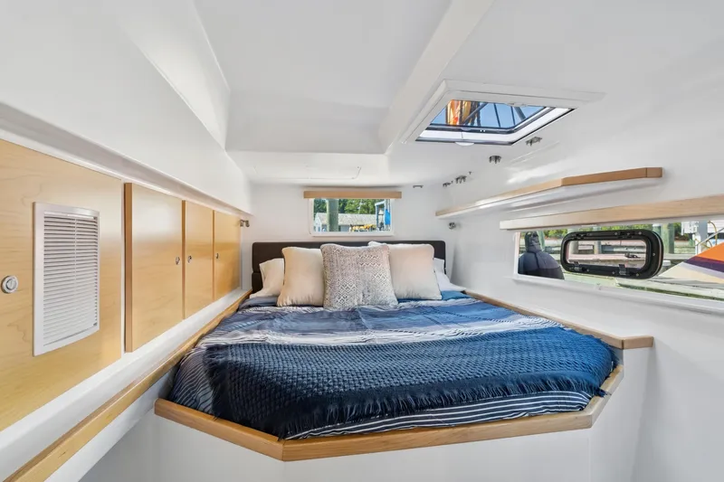 Carolina Red Yacht Photos Pics Luxurious cabin interior of 2024 St Francis 460 yacht with cozy bedding and modern design.