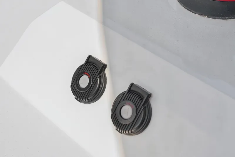 Carolina Red Yacht Photos Pics Close-up of St Francis 460 boat deck details, featuring two black circular fixtures.