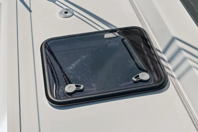 Carolina Red Yacht Photos Pics Hatch window on 2024 St Francis 460 yacht deck, featuring sleek design and secure latches.