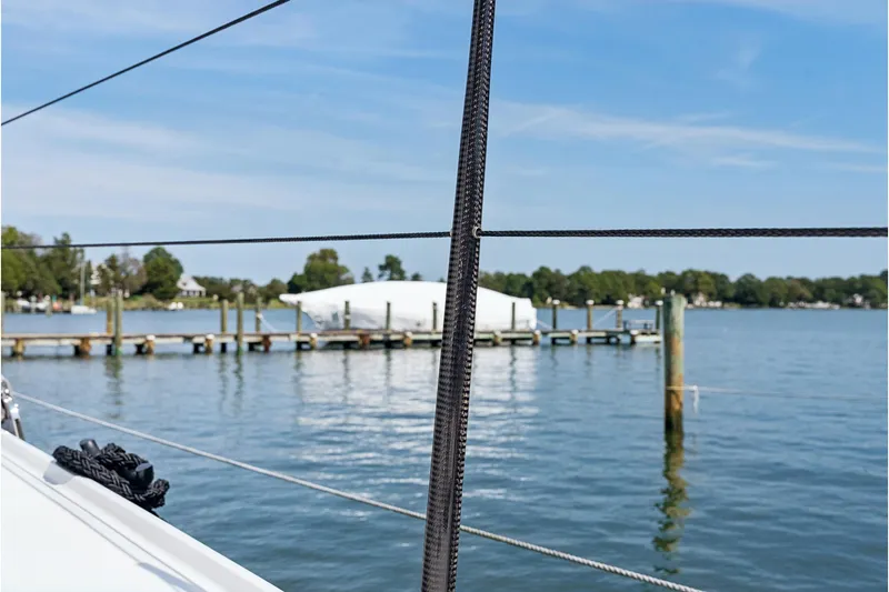 Carolina Red Yacht Photos Pics Sailboat view from St Francis 460, 2024 model, overlooking a serene marina.