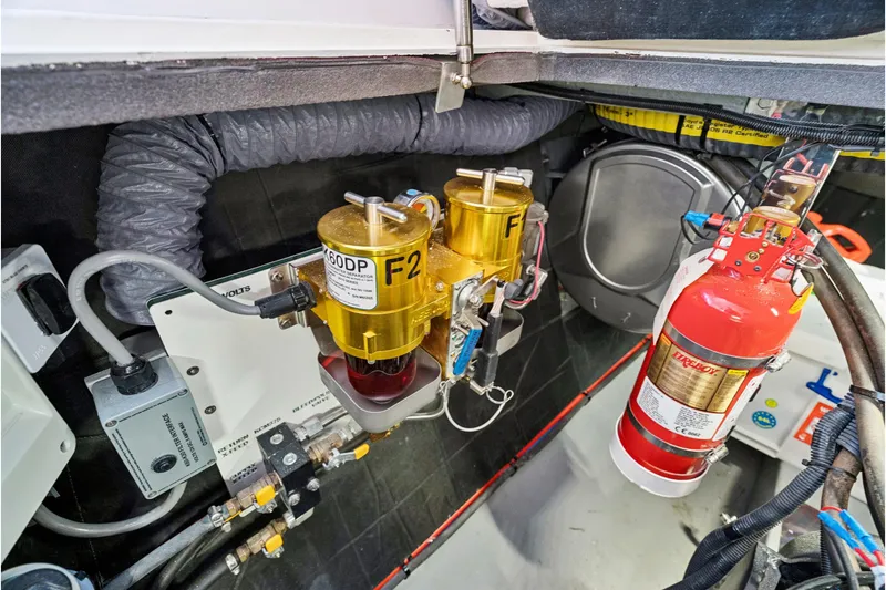 Carolina Red Yacht Photos Pics Engine room of 2024 St Francis 460 with fuel filters and fire extinguisher.