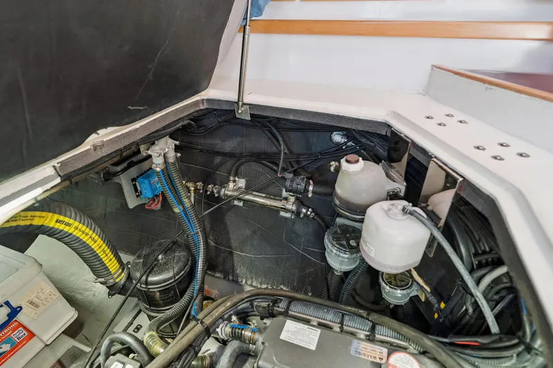 Carolina Red Yacht Photos Pics Engine compartment of 2024 St Francis 460 boat, showcasing mechanical components and wiring.