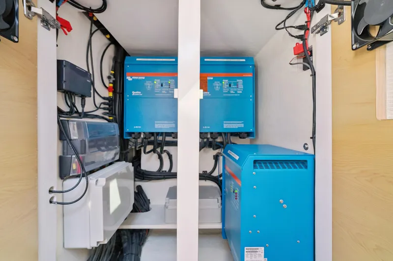 Carolina Red Yacht Photos Pics Electrical system setup in 2024 St Francis 460 model, featuring blue inverters and wiring.