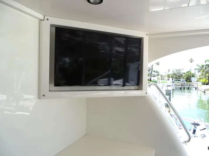 Quintessa Yacht Photos Pics Flat-screen TV on 2014 Horizon PC52 yacht, dockside view.