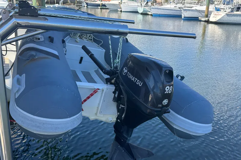 Southern Wild Yacht Photos Pics Inflatable boat with Tohatsu outboard motor, docked near Lagoon 40, 2018 model.