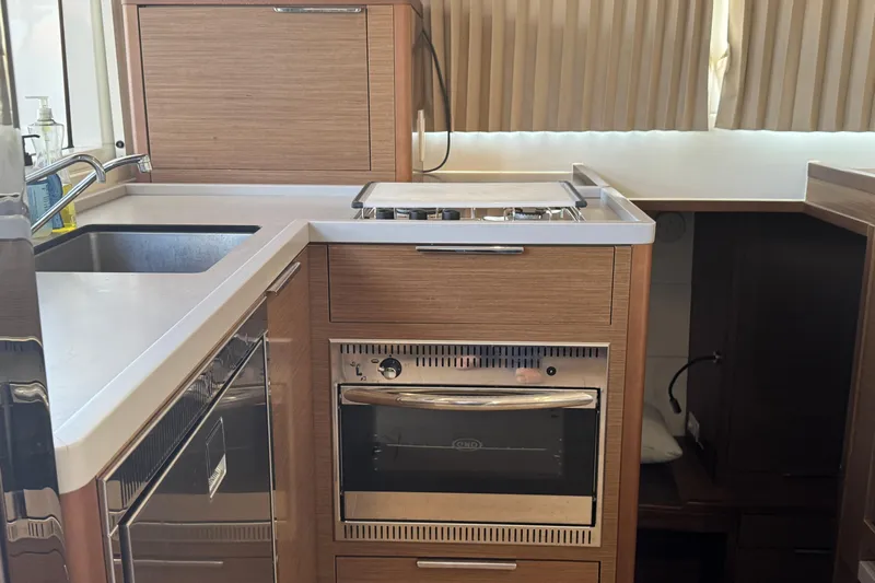 Southern Wild Yacht Photos Pics Modern kitchen in 2018 Lagoon 40 yacht with stove, oven, and sink.