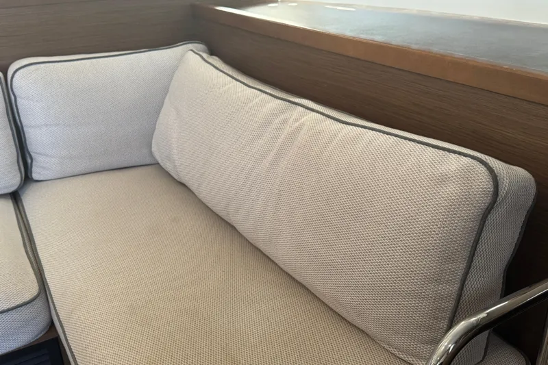 Southern Wild Yacht Photos Pics Beige cushioned seating on a 2018 Lagoon 40 yacht interior.
