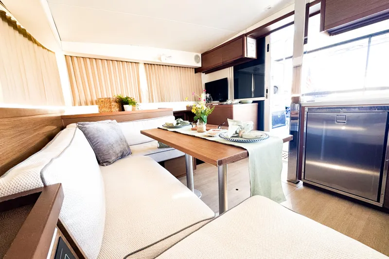 Southern Wild Yacht Photos Pics Luxurious interior of 2018 Lagoon 40 catamaran with elegant dining area and modern decor.