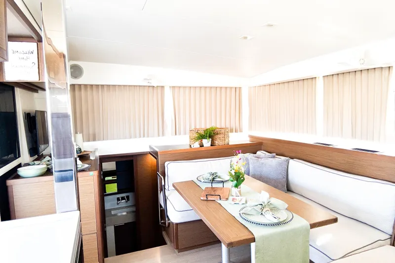 Southern Wild Yacht Photos Pics Interior of 2018 Lagoon 40 catamaran with elegant dining area and modern decor.