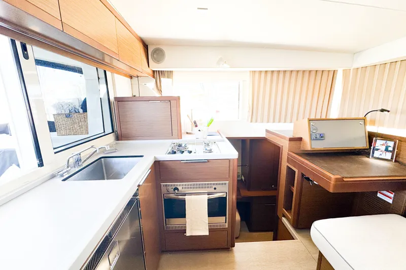 Southern Wild Yacht Photos Pics Interior of 2018 Lagoon 40 yacht featuring modern kitchen and navigation area.