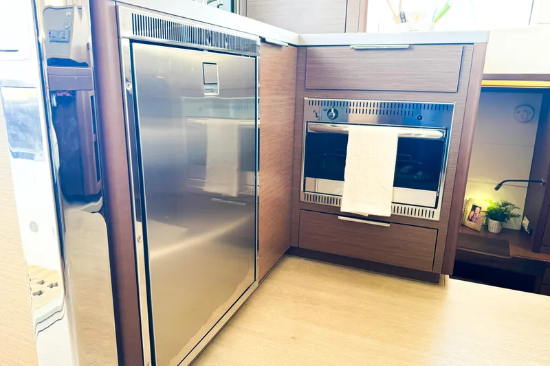 Southern Wild Yacht Photos Pics Modern kitchen interior of 2018 Lagoon 40 catamaran with stainless steel appliances.