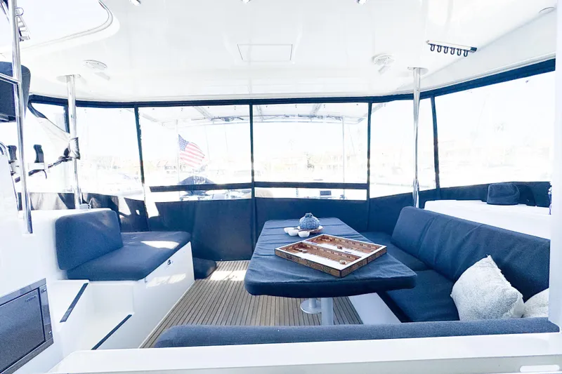 Southern Wild Yacht Photos Pics Spacious interior of 2018 Lagoon 40 catamaran with comfortable seating and table setup.