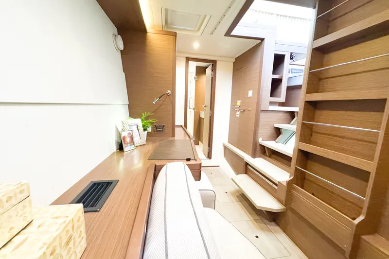 Southern Wild Yacht Photos Pics 2018 Lagoon 40 yacht interior with modern wood finish and cozy seating area.