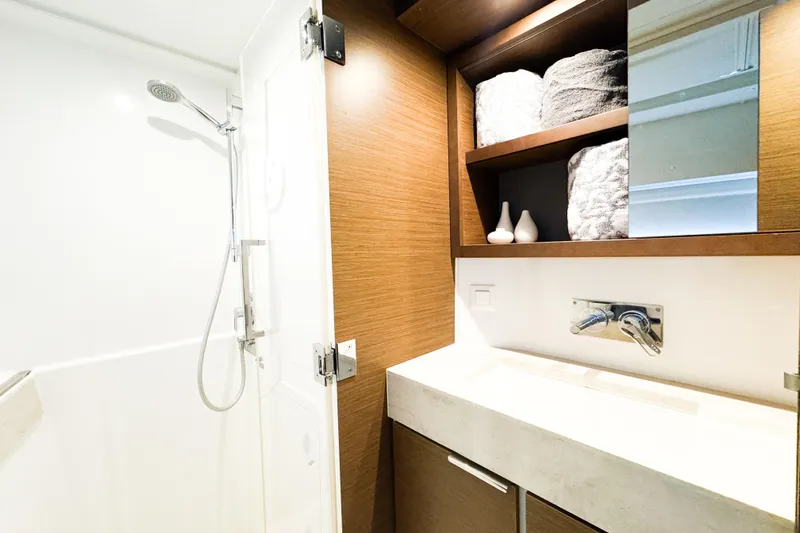 Southern Wild Yacht Photos Pics Modern bathroom in 2018 Lagoon 40 yacht with shower and wooden cabinetry.