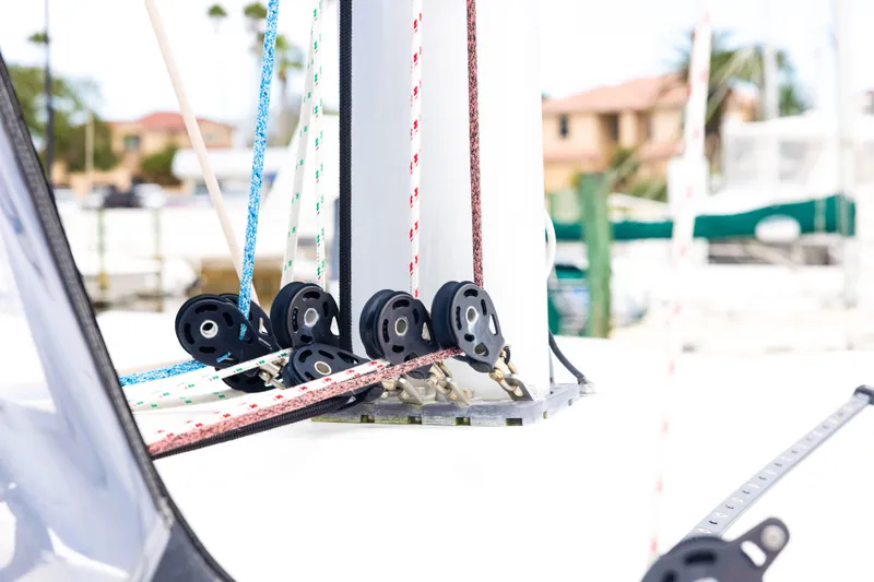Southern Wild Yacht Photos Pics Close-up of rigging on a 2018 Lagoon 40 catamaran, featuring colorful ropes and pulleys.