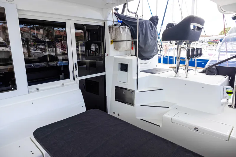 Southern Wild Yacht Photos Pics 2018 Lagoon 40 yacht interior with seating, helm station, and modern design elements.