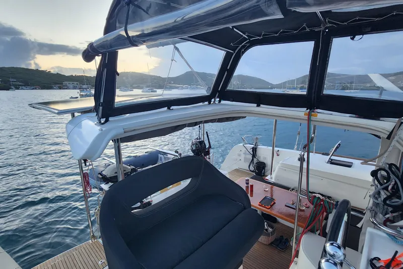 Southern Wild Yacht Photos Pics 2018 Lagoon 40 catamaran cockpit with scenic marina view at sunset.