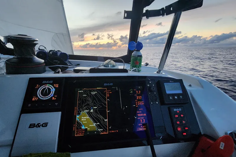 Southern Wild Yacht Photos Pics Cockpit view of 2018 Lagoon 40 sailboat with navigation system at sunset.
