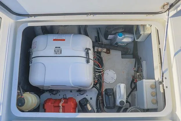 Southern Wild Yacht Photos Pics Engine compartment of 2018 Lagoon 40 catamaran with various mechanical components and storage.