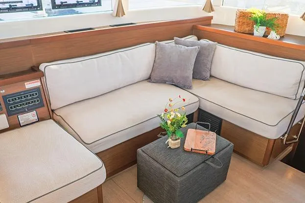 Southern Wild Yacht Photos Pics Luxurious interior of 2018 Lagoon 40 catamaran with cozy seating and elegant decor.