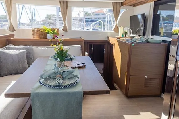 Southern Wild Yacht Photos Pics Interior of 2018 Lagoon 40 catamaran with elegant dining setup and modern decor.