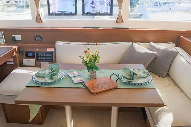 Southern Wild Yacht Photos Pics Interior of 2018 Lagoon 40 catamaran with elegant dining setup and cozy seating.