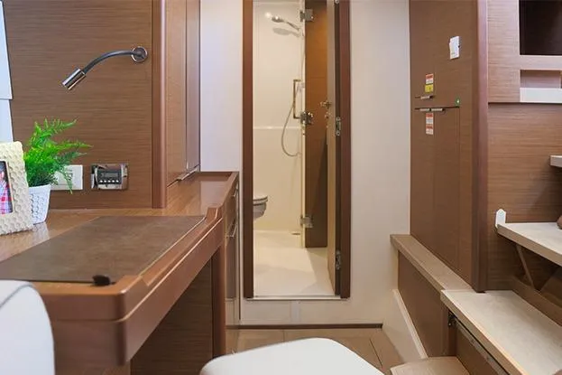 Southern Wild Yacht Photos Pics Interior of 2018 Lagoon 40 yacht, featuring a modern bathroom and wooden furnishings.