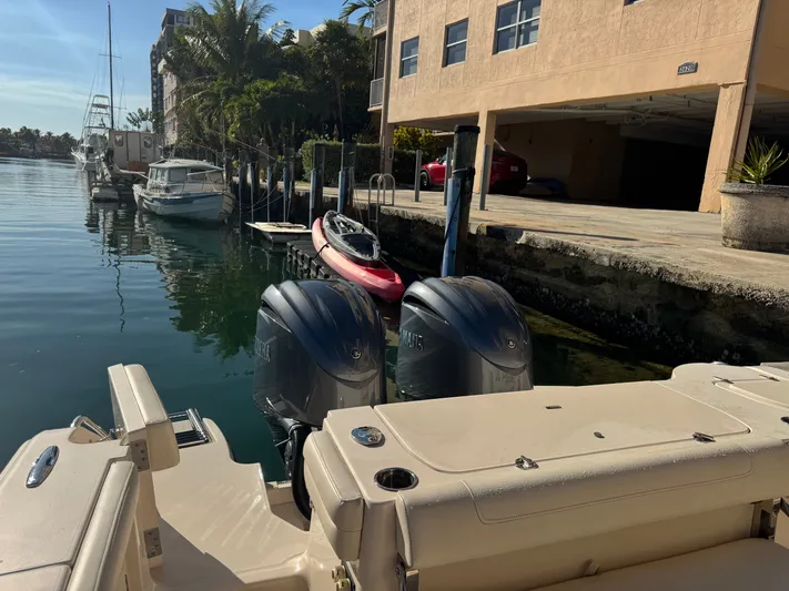 Bugs And Brew Yacht Photos Pics Grady-White 326 CAN 2024 boat docked with outboard motors.