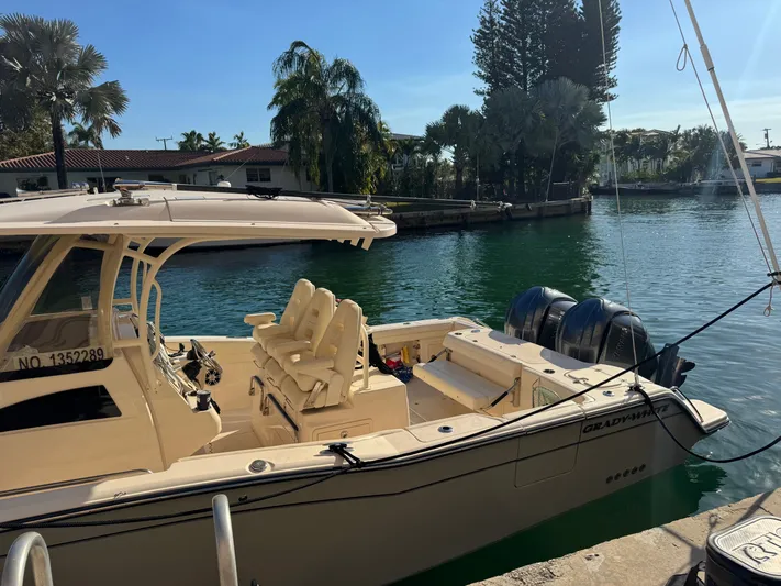 Bugs And Brew Yacht Photos Pics 2024 Grady-White 326 CAN boat docked on a sunny day.