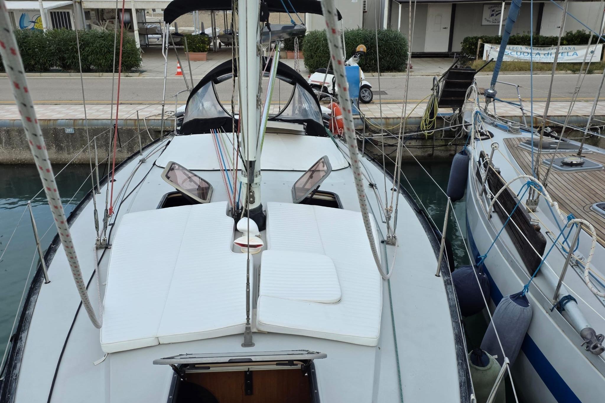 1981 Comar Comet 11 sailboat docked at a marina, view from above.