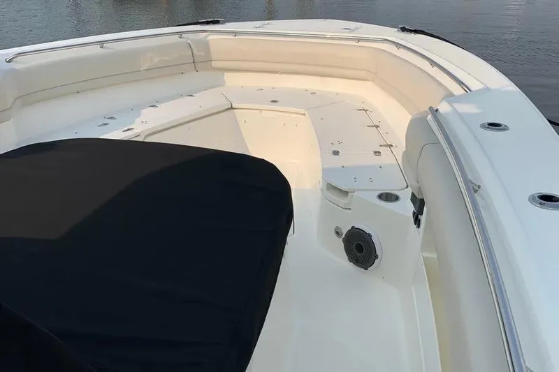  Yacht Photos Pics 2019 Boston Whaler 380 Outrage boat interior with cushioned seating and covered console.