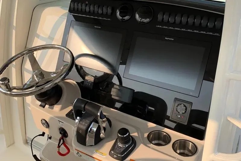  Yacht Photos Pics Control panel of a 2019 Boston Whaler 380 Outrage with dual screens and steering wheel.