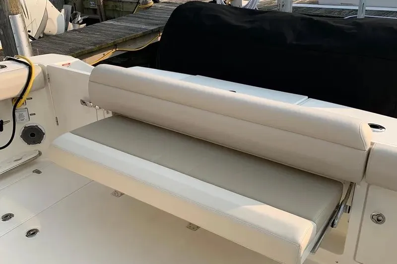  Yacht Photos Pics 2019 Boston Whaler 380 Outrage boat with beige seating and dockside view.