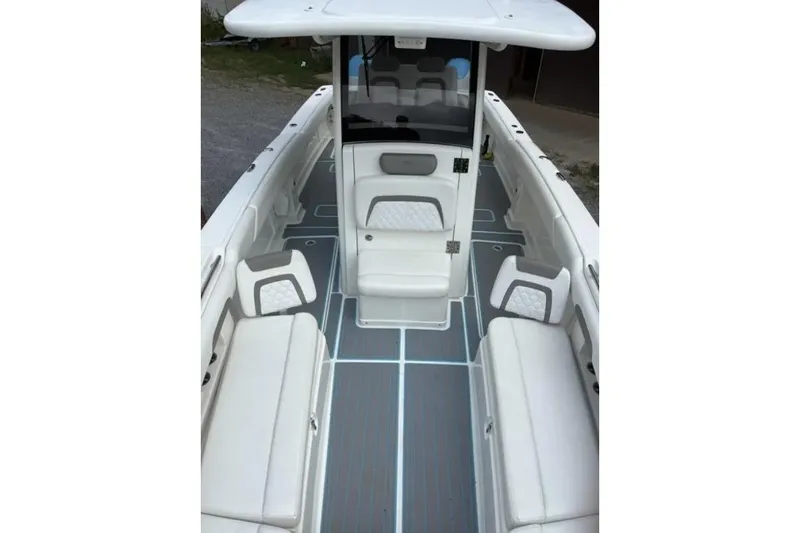  Yacht Photos Pics 2020 World Cat 280 CC-X boat interior with cushioned seating and sleek design.
