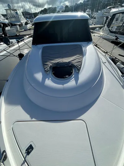  Yacht Photos Pics 2022 Tiara Yachts C39 Coupe, sleek design, docked in marina.