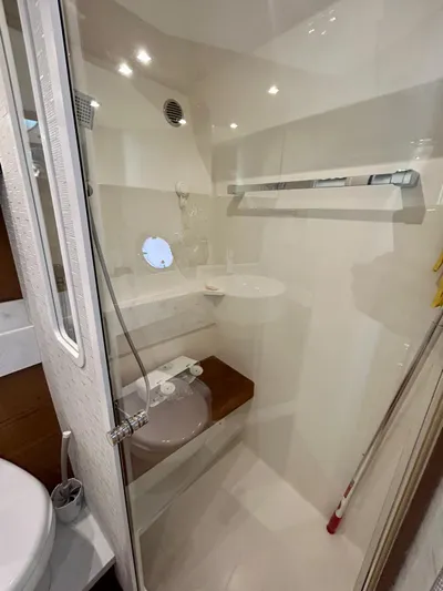 Yacht Photos Pics 2022 Tiara Yachts C39 Coupe bathroom with modern fixtures and sleek design.